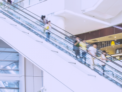 people take a white escalator 