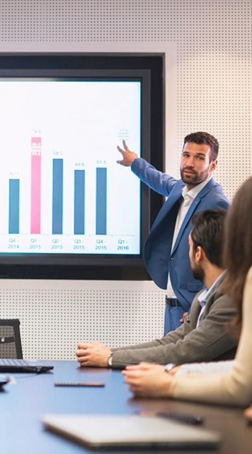 A businessman showing presentation to his colleagues