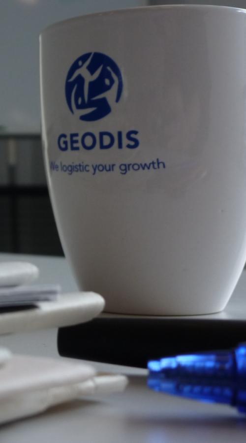 GEODIS mug and books